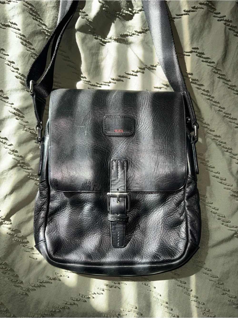 Tumi Black Leather Messenger Bag with Buckle Front
